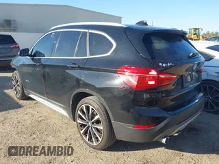 2018 BMW X1 sDrive28i with VIN WBXHU7C30J5L04913, listed as a IAAI auction lot 41755344 with 101,867 mi miles. Bid and sale history available at carsss.com. Image 3.