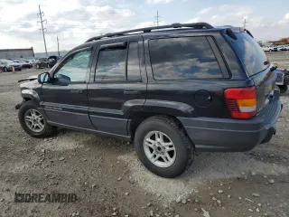2004 Jeep Grand Cherokee Laredo with VIN 1J4GW48S84C184757, listed as a Copart auction lot 52895745 with 242,307 mi miles and Salvage Title. Bid and sale history available at carsss.com. Image 2.