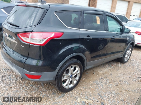 2013 Ford Escape SEL with VIN 1FMCU9H97DUA80867, listed as a IAAI auction lot 42709994 with Not provided miles and . Bid and sale history available at DreamBid. Image 4.