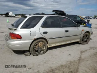 1999 Subaru Impreza L with VIN JF1GF4351XH815210, listed as a Copart auction lot 71250504 with 141,806 mi miles and Salvage title. Bid and sale history available at DreamBid. Image 3.