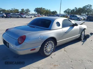 2004 Ford Thunderbird Deluxe with VIN 1FAHP60A84Y100984, listed as a IAAI auction lot 40978553 with 113,051 mi miles. Bid and sale history available at carsss.com. Image 4.