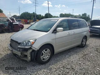 2005 Honda Odyssey EX-L with VIN 5FNRL38765B105328, listed as a Copart auction lot 63403985 with 256,992 mi miles and Salvage title. Bid and sale history available at DreamBid. Image 1.
