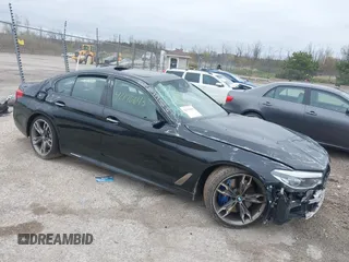2018 BMW 5 Series M550i xDrive with VIN WBAJB9C56JB286742, listed as a IAAI auction lot 42176643 with 61,445 mi miles and . Bid and sale history available at DreamBid. Image 1.