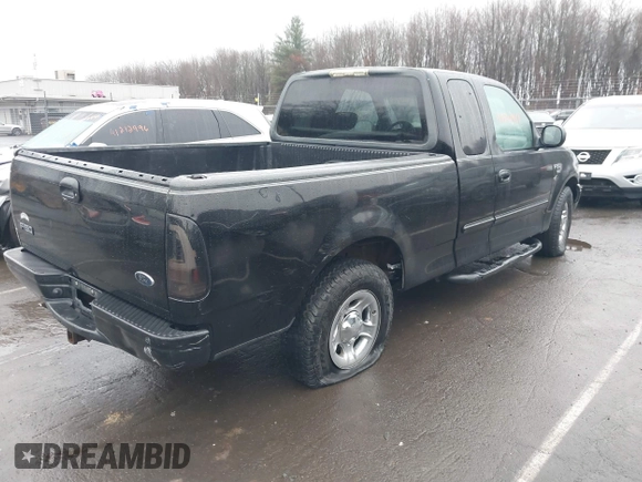 2002 Ford F-150 XL with VIN 1FTRX17W92NA80214, listed as a IAAI auction lot 41074951 with 164,048 mi miles. Bid and sale history available at carsss.com. Image 4.