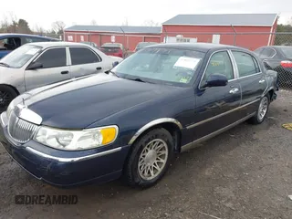 2001 Lincoln Town Car Signature with VIN 1LNHM82W61Y733577, listed as a IAAI auction lot 41899175 with 105,083 mi miles and . Bid and sale history available at DreamBid. Image 17.