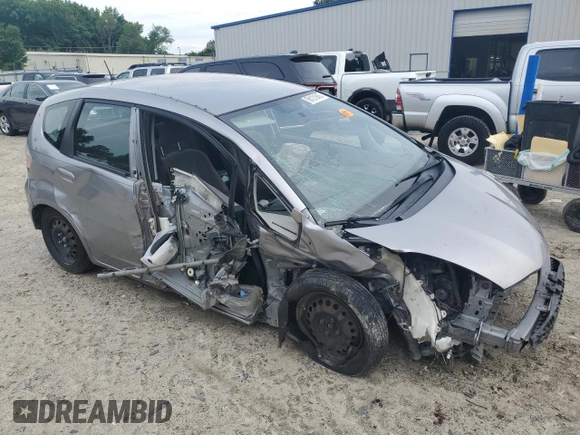 2009 Honda Fit with VIN JHMGE88249S025083, listed as a Copart auction lot 58121945 with Not provided miles and Salvage title. Bid and sale history available at DreamBid. Image 4.