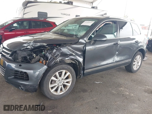 2014 Volkswagen Touareg Sport with VIN WVGEF9BP0ED015273, listed as a IAAI auction lot 42046823 with 84,694 mi miles and . Bid and sale history available at DreamBid. Image 6.