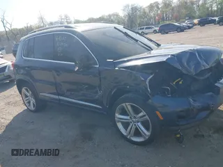 2014 Volkswagen Tiguan S z VIN WVGBV3AX7EW545538, wystawiony jako IAAI lot #42083281 z przebiegiem 129 227 mil mil oraz . Historia ofert i sprzedaży dostępna na DreamBid. Obrazek 1.