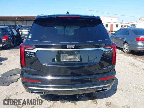 2020 Cadillac XT6 FWD Premium Luxury z VIN 1GYKPERS0LZ232338, wystawiony jako IAAI lot #41845562 z przebiegiem 86 839 mil mil oraz . Historia ofert i sprzedaży dostępna na DreamBid. Obrazek 16.