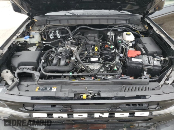 2022 Ford Bronco z VIN 1FMDE5BH2NLB22556, wystawiony jako Copart lot #60717055 z przebiegiem 27 757 mil mil oraz Szkoda całkowita • Salvage title. Historia ofert i sprzedaży dostępna na DreamBid. Obrazek 12.