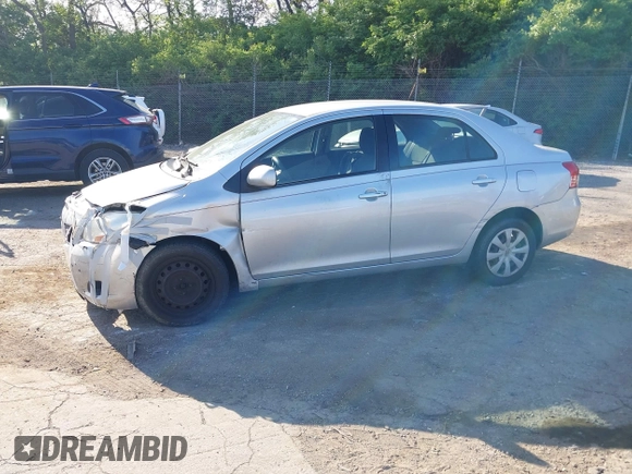 2009 Toyota Yaris with VIN JTDBT903891307874, listed as a IAAI auction lot 42150366 with 218,350 mi miles. Bid and sale history available at carsss.com. Image 2.