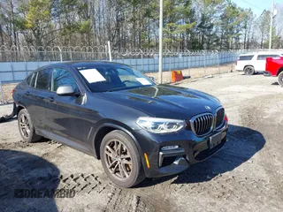 2019 BMW X4 M40i with VIN 5UXUJ5C57KLJ63652, listed as a IAAI auction lot 41294454 with 77,313 mi miles. Bid and sale history available at carsss.com. Image 1.