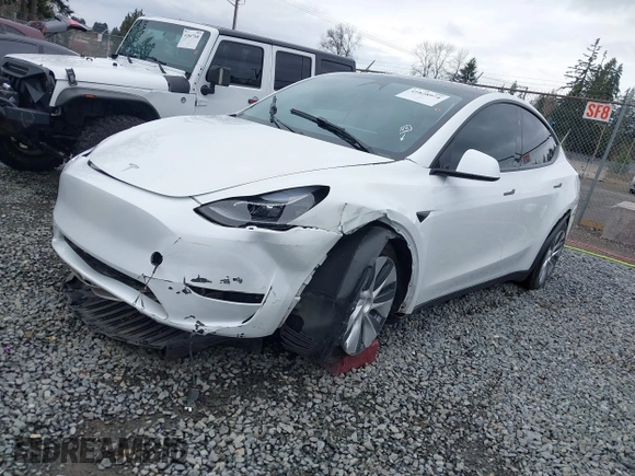 2023 Tesla Model Y Long Range with VIN 7SAYGDEE7PF809164, listed as a IAAI auction lot 41828974 with 31,772 mi miles. Bid and sale history available at carsss.com. Image 2.
