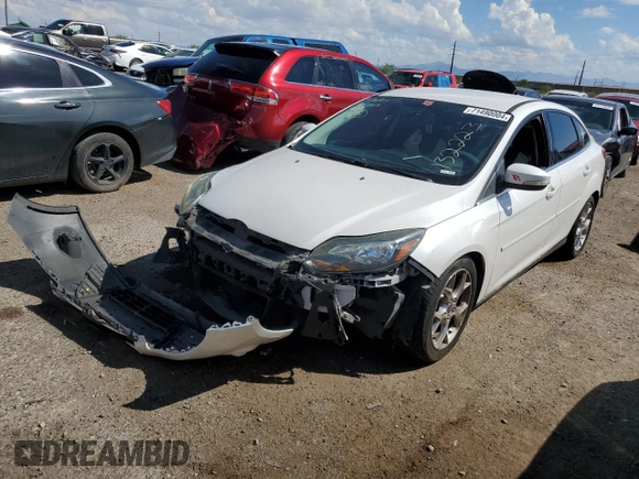 2014 Ford Focus Titanium with VIN 1FADP3J26EL132223, listed as a Copart auction lot 71490004 with 131,233 mi miles and Salvage Title. Bid and sale history available at DreamBid. Image 1.