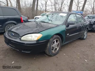 2003 Ford Taurus SEL Deluxe with VIN 1FAHP56S83A243290, listed as a IAAI auction lot 41743609 with 206,399 mi miles. Bid and sale history available at carsss.com. Image 2.