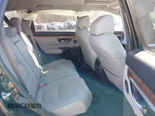 2020 Honda CR-V Touring with VIN 2HKRW2H98LH626651, listed as a IAAI auction lot 41668951 with 64,391 mi miles and . Bid and sale history available at DreamBid. Image 8.