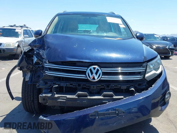 2015 Volkswagen Tiguan SE with VIN WVGAV7AX8FW595806, listed as a IAAI auction lot 42644395 with 51,638 mi miles and . Bid and sale history available at DreamBid. Image 13.