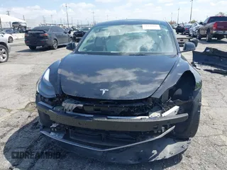 2022 Tesla Model 3 with VIN 5YJ3E1EA4NF316127, listed as a IAAI auction lot 41939191 with 30,857 mi miles. Bid and sale history available at carsss.com. Image 6.