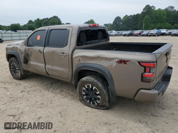 2023 Nissan Frontier Pro-4X with VIN 1N6ED1EK0PN617872, listed as a Copart auction lot 57125435 with 97,981 mi miles and Salvage title. Bid and sale history available at DreamBid. Image 2.