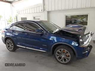 2015 BMW X4 xDrive28i with VIN 5UXXW3C51F0M87268, listed as a IAAI auction lot 42366363 with 143,285 mi miles and . Bid and sale history available at DreamBid. Image 14.