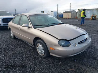 1999 Ford Taurus SE with VIN 1FAFP53U0XG209151, listed as a IAAI auction lot 41778371 with 107,262 mi miles. Bid and sale history available at carsss.com. Image 1.