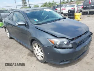 2006 Scion tC with VIN JTKDE177260081483, listed as a IAAI auction lot 42076072 with 156,556 mi miles. Bid and sale history available at carsss.com. Image 1.