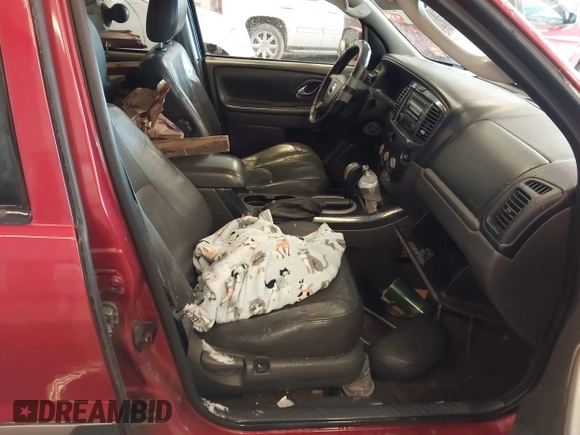 2006 Mazda Tribute S with VIN 4F2YZ06196KM14531, listed as a IAAI auction lot 41594920 with 297,204 mi miles and . Bid and sale history available at carsss.com. Image 5.