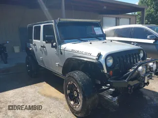 2008 Jeep Wrangler Rubicon z VIN 1J8GA69178L588850, wystawiony jako IAAI lot #42327032 z przebiegiem 142 505 mil mil oraz . Historia ofert i sprzedaży dostępna na DreamBid. Obrazek 1.
