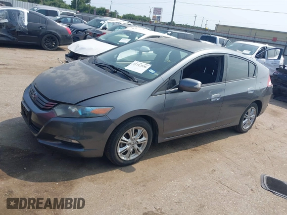 2010 Honda Insight EX with VIN JHMZE2H71AS043465, listed as a IAAI auction lot 42312556 with 151,009 mi miles and . Bid and sale history available at DreamBid. Image 2.