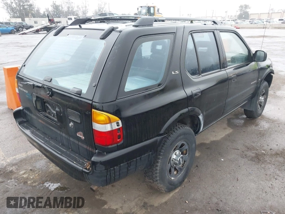1998 Isuzu Rodeo S z VIN 4S2CM58W6W4336183, wystawiony jako IAAI lot #41874570 z przebiegiem 162 097 mil mil oraz . Historia ofert i sprzedaży dostępna na DreamBid. Obrazek 4.