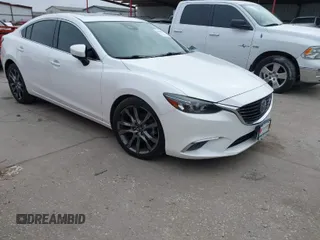 2017 Mazda 6 Grand Touring with VIN JM1GL1W57H1126716, listed as a IAAI auction lot 41619715 with 105,332 mi miles and . Bid and sale history available at DreamBid. Image 1.