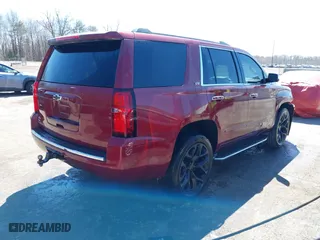 2016 Chevrolet Tahoe LTZ with VIN 1GNSKCKC9GR422695, listed as a IAAI auction lot 41880564 with 302,106 mi miles. Bid and sale history available at carsss.com. Image 4.
