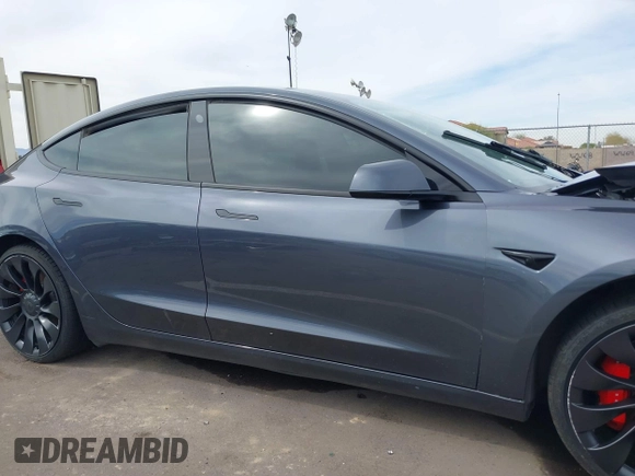 2022 Tesla Model 3 Performance with VIN 5YJ3E1EC3NF296891, listed as a IAAI auction lot 41808329 with 82,682 mi miles and . Bid and sale history available at DreamBid. Image 13.