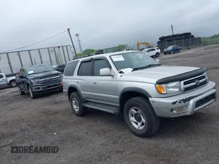 1999 Toyota 4Runner SR5 z VIN JT3HN86R7X0236149, wystawiony jako IAAI lot #42196095 z przebiegiem 241 580 mil mil oraz . Historia ofert i sprzedaży dostępna na DreamBid. Obrazek 1.