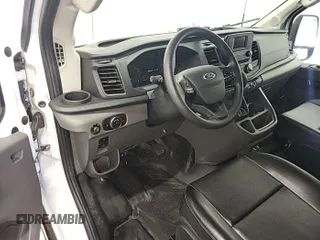 2023 Ford Transit Cargo with VIN 1FTBW3U84PKB20116, listed as a IAAI auction lot 42748031 with 6,591 mi miles and . Bid and sale history available at DreamBid. Image 13.