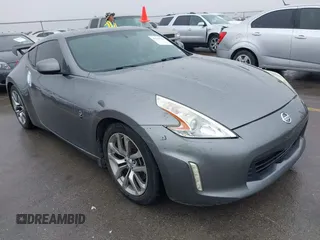 2014 Nissan 370Z Nismo z VIN JN1AZ4EH2EM636552, wystawiony jako IAAI lot #41959141 z przebiegiem 125 460 mil mil oraz . Historia ofert i sprzedaży dostępna na DreamBid. Obrazek 1.