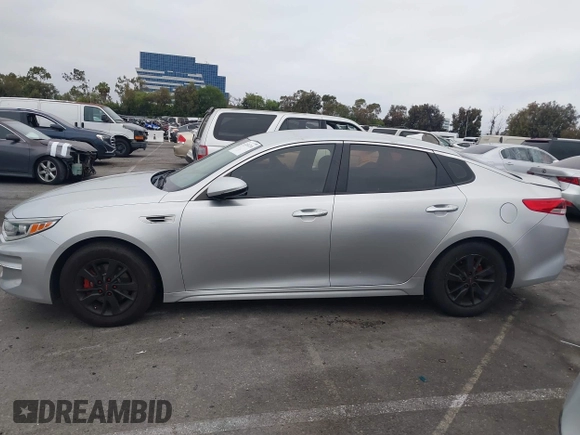 2018 Kia Optima S with VIN 5XXGT4L35JG216039, listed as a IAAI auction lot 42451216 with 91,679 mi miles and . Bid and sale history available at DreamBid. Image 14.