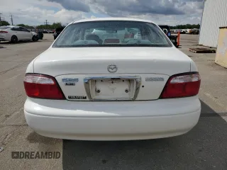 2000 Mazda 626 LX z VIN 1YVGF22C3Y5165341, wystawiony jako Copart lot #56575075 z przebiegiem 58 645 mil mil oraz Szkody całkowita. Historia ofert i sprzedaży dostępna na DreamBid. Obrazek 6.