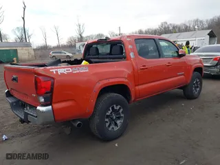 2018 Toyota Tacoma SR with VIN 3TMCZ5AN4JM161623, listed as a IAAI auction lot 41677439 with 75,549 mi miles. Bid and sale history available at carsss.com. Image 4.
