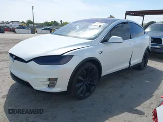2021 Tesla Model X Long Range Plus with VIN 5YJXCBE23MF321243, listed as a IAAI auction lot 42100580 with 59,878 mi miles and . Bid and sale history available at carsss.com. Image 19.