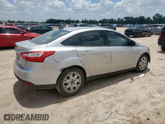 2012 Ford Focus SE with VIN 1FAHP3F29CL287498, listed as a Copart auction lot 61476855 with 139,801 mi miles and Salvage title. Bid and sale history available at DreamBid. Image 3.
