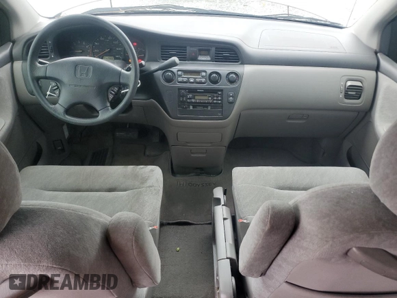 2000 Honda Odyssey EX with VIN 2HKRL1865YH513885, listed as a Copart auction lot 50223505 with 214,627 mi miles and Salvage Title. Bid and sale history available at DreamBid. Image 8.