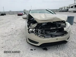 2016 Ford Focus SE z VIN 1FADP3F20GL267077, wystawiony jako Copart lot #53649665 z przebiegiem 106 329 mil mil oraz Szkoda całkowita • Salvage title. Historia ofert i sprzedaży dostępna na DreamBid. Obrazek 11.