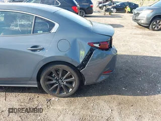 2024 Mazda 3 S Carbon Edition with VIN 3MZBPBCM6RM411828, listed as a IAAI auction lot 42802141 with 40,061 mi miles and . Bid and sale history available at DreamBid. Image 6.
