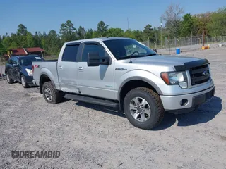 2013 Ford F-150 XL with VIN 1FTFW1ET0DFC85741, listed as a IAAI auction lot 42022221 with 156,509 mi miles. Bid and sale history available at carsss.com. Image 1.