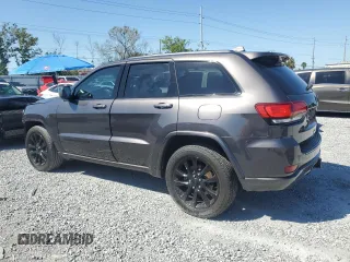2017 Jeep Grand Cherokee 75th Anniversary with VIN 1C4RJEAG4HC700191, listed as a Copart auction lot 52520655 with 130,828 mi miles and Salvage title. Bid and sale history available at DreamBid. Image 2.