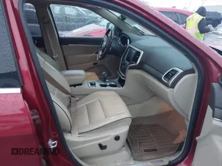 2014 Jeep Grand Cherokee Overland with VIN 1C4RJFCG9EC299235, listed as a IAAI auction lot 41670065 with 108,589 mi miles and . Bid and sale history available at DreamBid. Image 5.