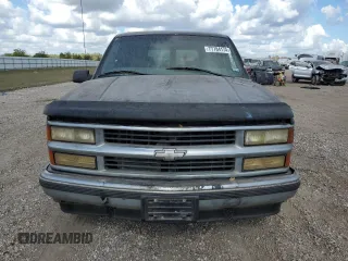 1999 Chevrolet Suburban with VIN 3GNEC16R7XG141671, listed as a Copart auction lot 77784174 with 207,234 mi miles and Salvage Title. Bid and sale history available at carsss.com. Image 5.