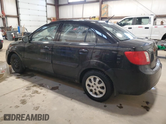 2010 Kia Rio with VIN KNADH4B37A6641845, listed as a Copart auction lot 51861215 with 163,894 mi miles and Salvage Title. Bid and sale history available at DreamBid. Image 2.