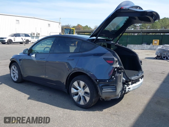 2023 Tesla Model Y Long Range with VIN 7SAYGDEE7PF856985, listed as a IAAI auction lot 42097675 with 13,112 mi miles and . Bid and sale history available at DreamBid. Image 3.